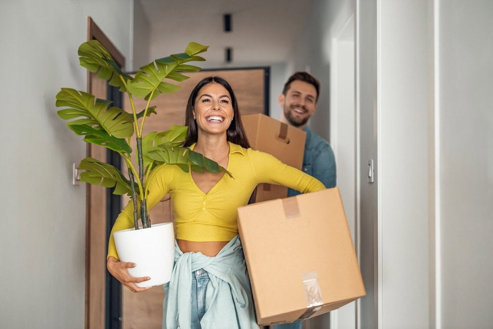 happy couple moving